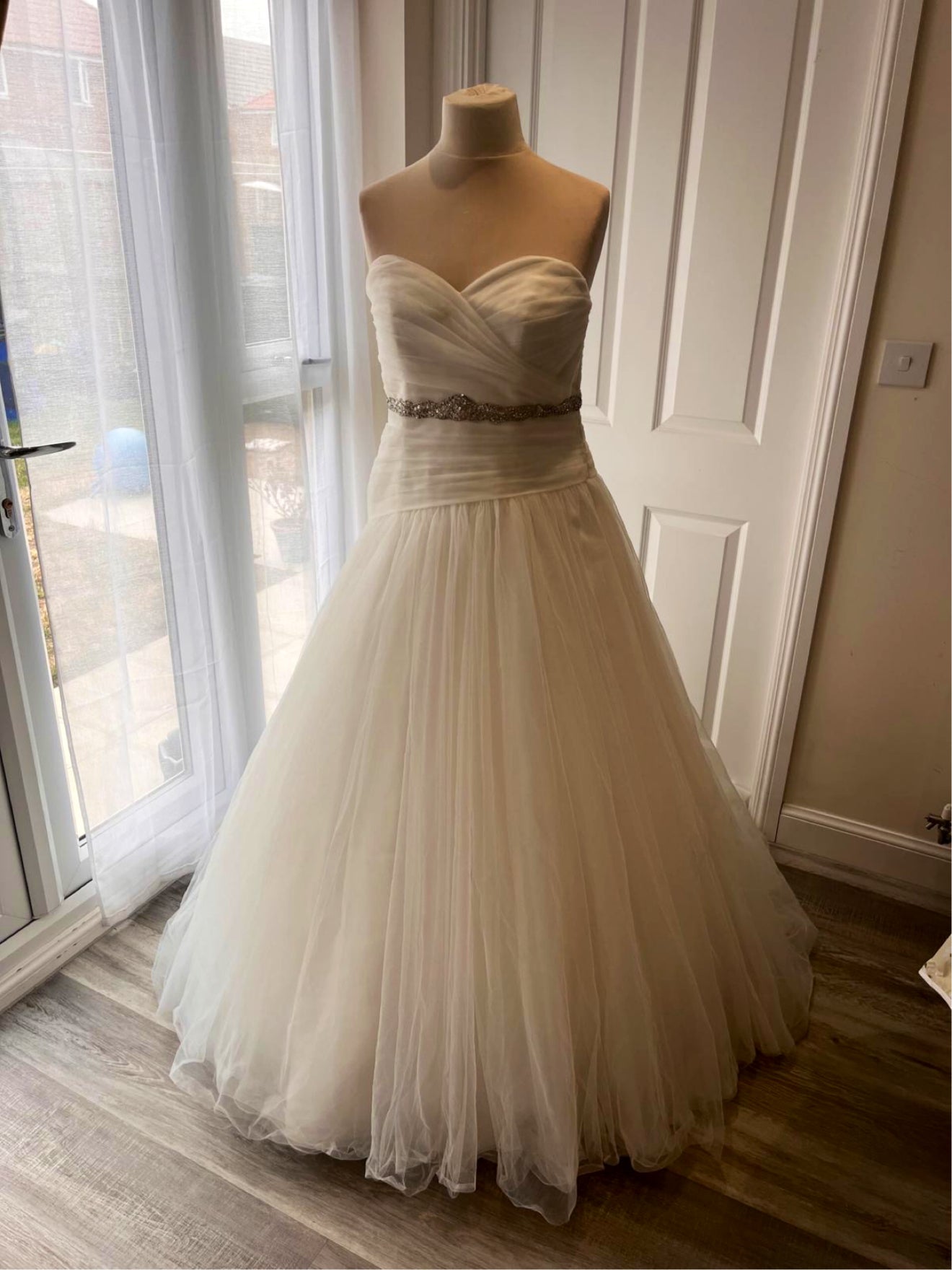 Restored bridal wedding dress after professional garment restoration