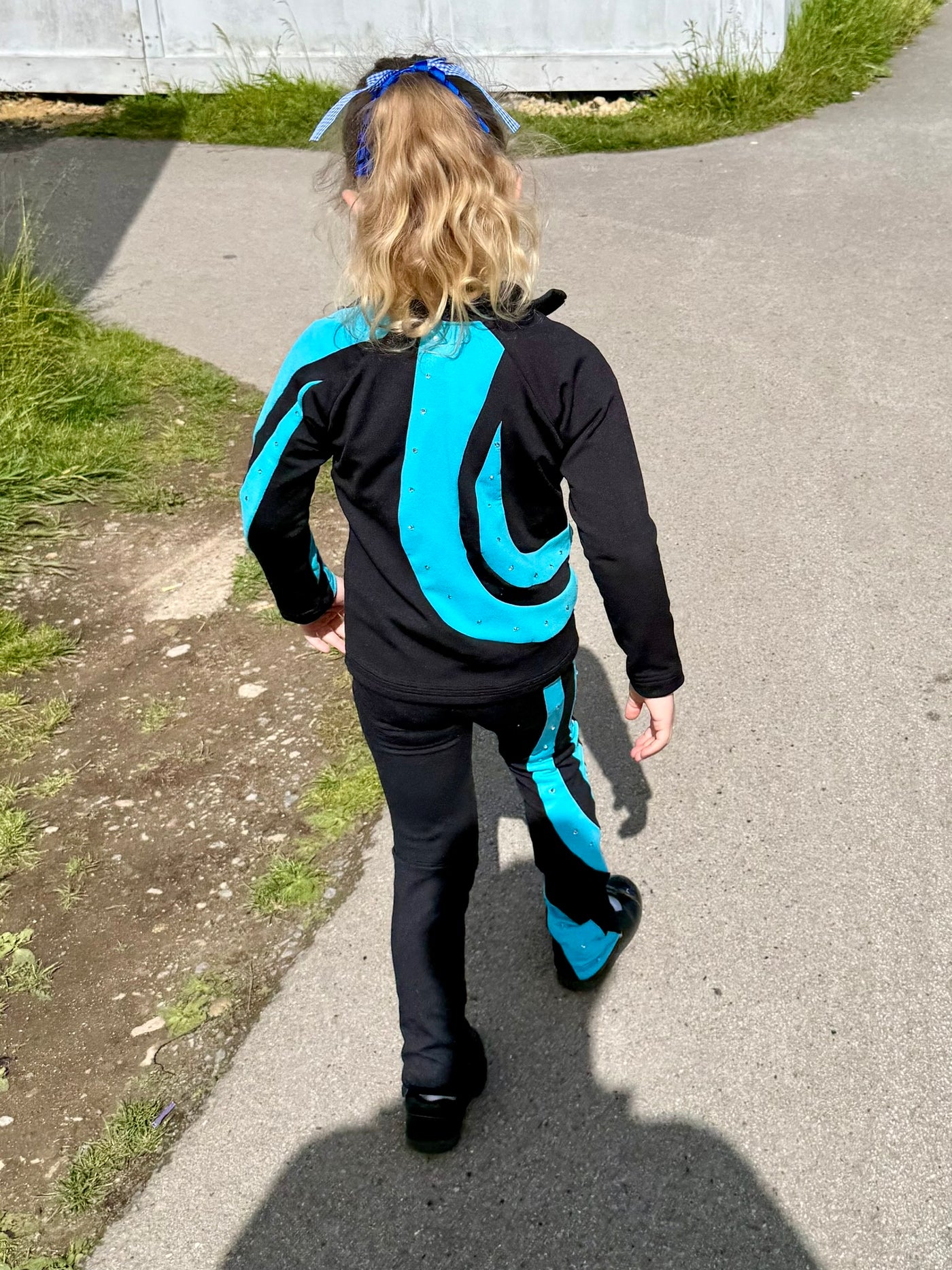 Figure skating jacket and leggings resized while preserving the spiral pattern